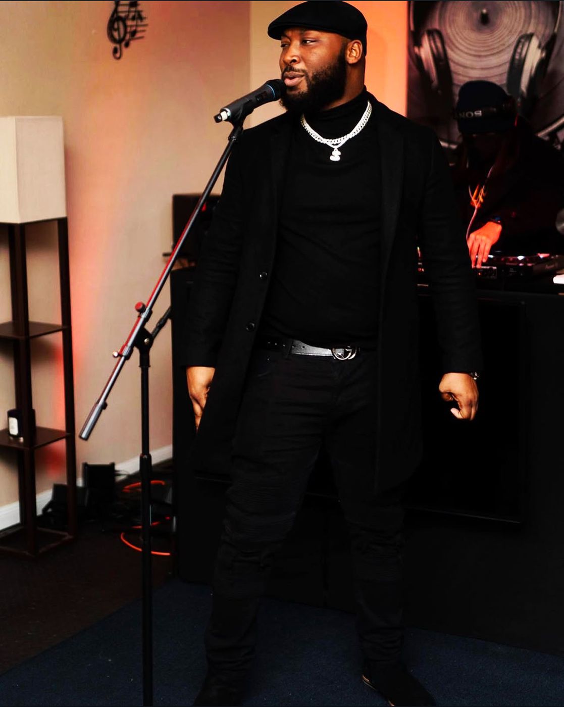 Self performing on stage at a microphone stand